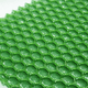 Superfície de esfregão esponja profissional com design em hexágonos verdes para limpeza eficaz.