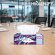 Lenços Faciais Tissue Maxi 2F Amoos em embalagem na mesa de reuniões, ideal para uso em ambiente profissional.